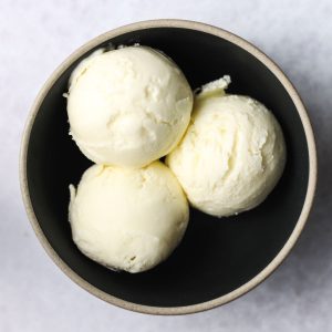 three scoops of vanilla ice cream with corn starcth in bowl